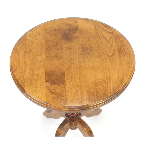 82 - Circular pine occasional table, 67cm high x 50cm in diameter