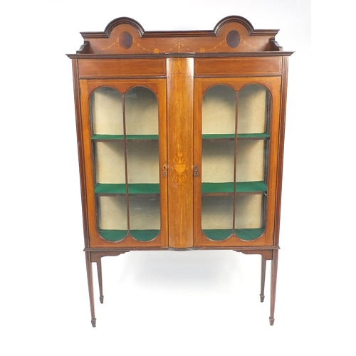 3 - Edwardian inlaid mahogany china cabinet fitted with two glazed doors enclosing two shelves, the cent... 