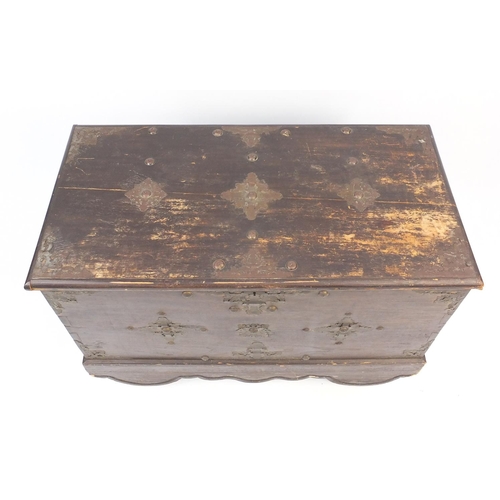 47 - Indian stained hardwood chest with brass mounts and wooden wheels, 70cm high x 100cm wide x 50cm dee... 