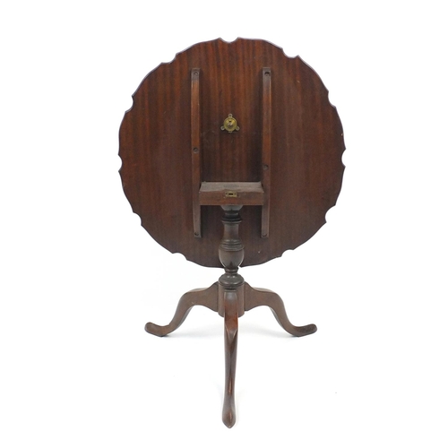 26 - Mahogany tilt top table with shaped scalloped top, 50cm high x 60cm in diameter