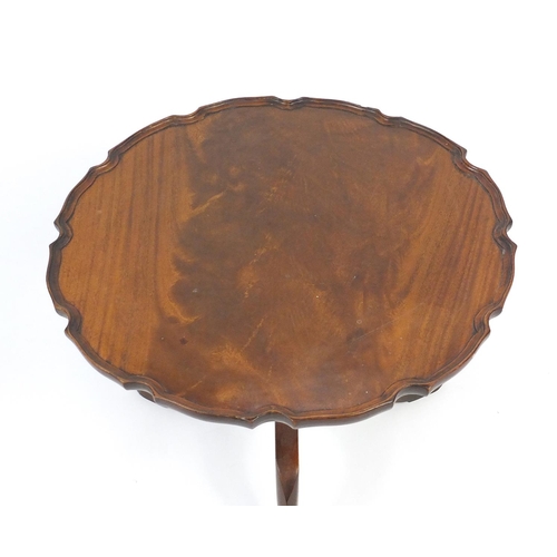 26 - Mahogany tilt top table with shaped scalloped top, 50cm high x 60cm in diameter