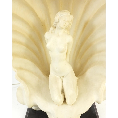 167 - Decorative nude female in a shell table lamp., 38cm high