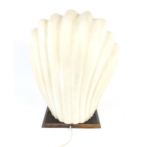 167 - Decorative nude female in a shell table lamp., 38cm high