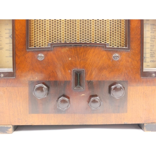 24 - Art Deco His Masters Voice walnut cased radio with Bakelite dials, 40cm high