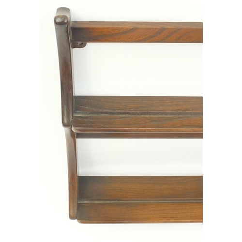 72 - Ercol elm wall hanging plate rack, 96cm long