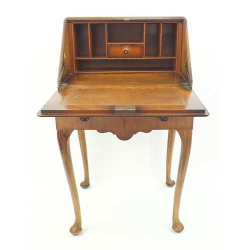 81 - Quarter veneered walnut bureau fitted with a fall above a frieze drawer, raised on cabriole legs, 94... 