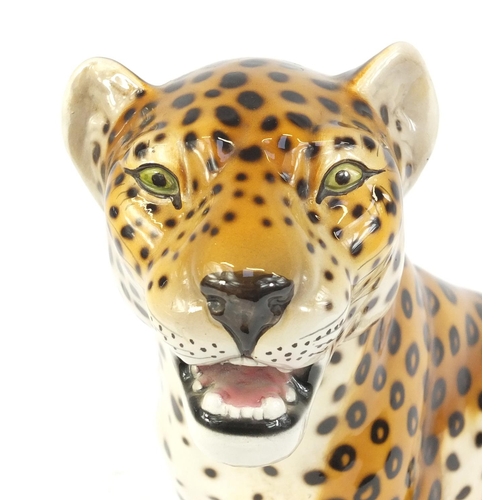 152 - Decorative ceramic seated leopard, 35cm high