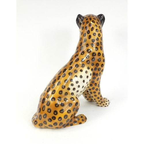 152 - Decorative ceramic seated leopard, 35cm high