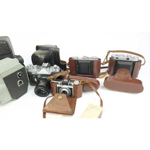 217 - Selection of vintage cameras including Kodak examples and a pair of Military interest Lemaire binocu... 