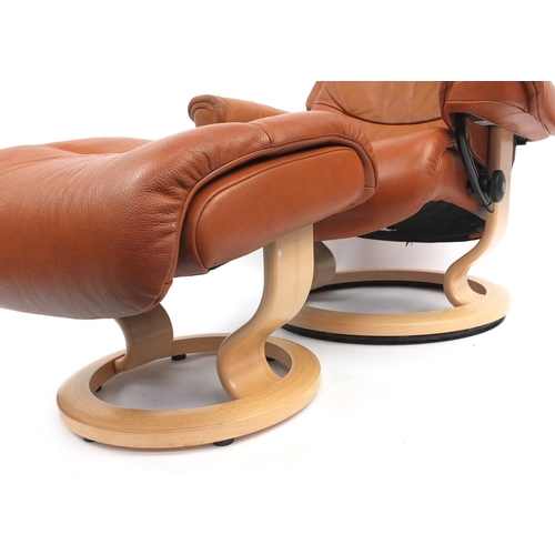6 - Brown leather Stressless chair and foot stool