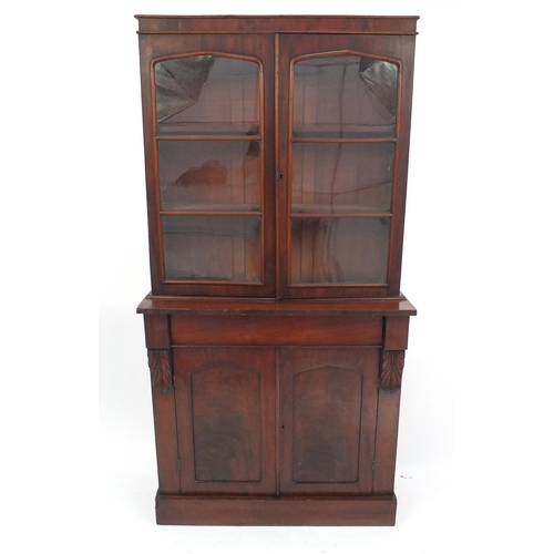 39 - Victorian mahogany bookcase fitted with a pair of glazed doors enclosing three shelves with cupboard... 