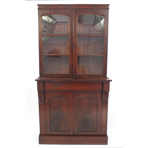 39 - Victorian mahogany bookcase fitted with a pair of glazed doors enclosing three shelves with cupboard... 