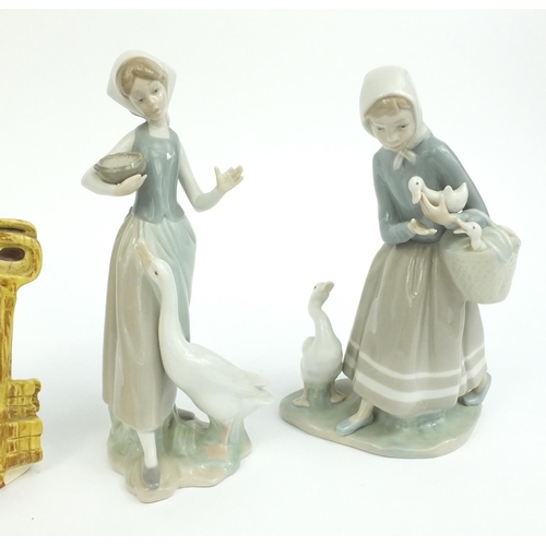 414 - Two Lladro figurines with geese and a Large Royal Doulton Toby Jug Gaoler D6570, the larger 23cm hig... 