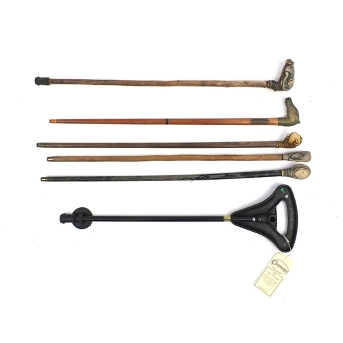 157 - Five wooden walking canes together with a shooting stick