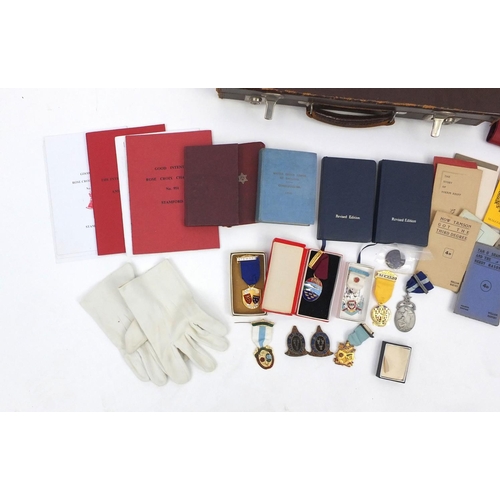 654 - Case of Masonic memorabilia including medals and an apron