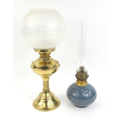 136 - Brass column oil lamp with globular glass shade and one other