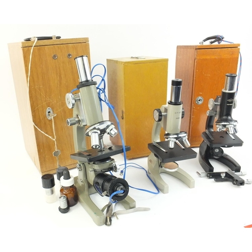 211 - Three microscopes comprising Opax, P.B.L and an unnamed example, some with spare lenses, all with pr... 