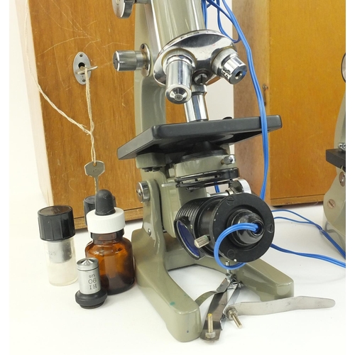 211 - Three microscopes comprising Opax, P.B.L and an unnamed example, some with spare lenses, all with pr... 