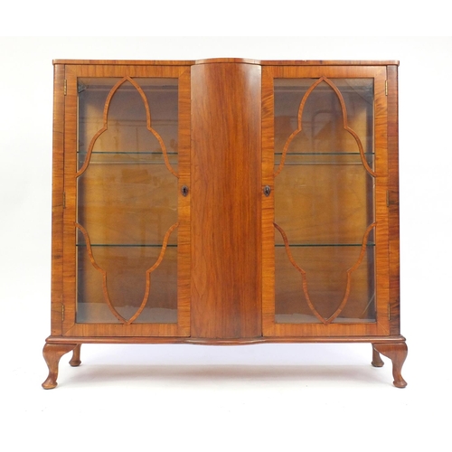 15 - Art Deco walnut china cabinet fitted with a pair of glazed doors, raised on cabriole feet, 114cm hig... 