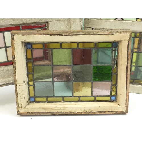 111 - Four leaded stained glass panels with wooden frames