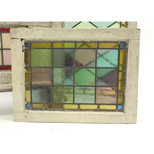 111 - Four leaded stained glass panels with wooden frames