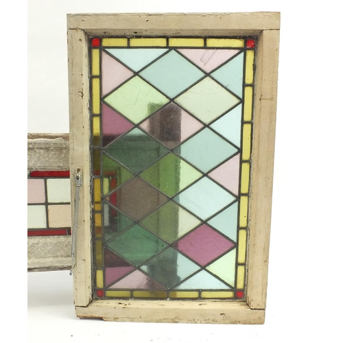 111 - Four leaded stained glass panels with wooden frames