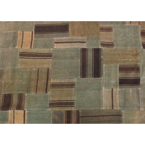 2031 - Turkish Ethnicon wool patchwork rug, label to the underside, 252cm x 182cm