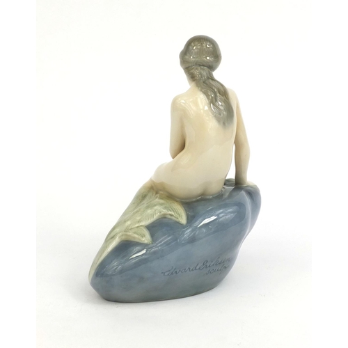 2062 - Royal Copenhagen figurine of a mermaid seated on a rock, factory marks and numbered 4431 to the base... 