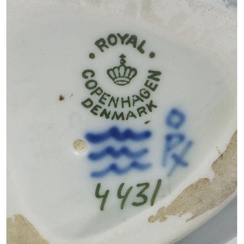 2062 - Royal Copenhagen figurine of a mermaid seated on a rock, factory marks and numbered 4431 to the base... 