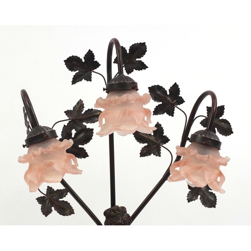 2117 - Large Art Nouveau style figural three branch table lamp with pink glass frilled shades, 82cm high