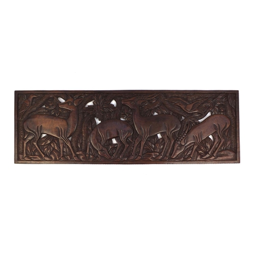 2115 - Large rectangular hardwood panel carved and pierced with deer's amongst trees, 150cm x 49cm