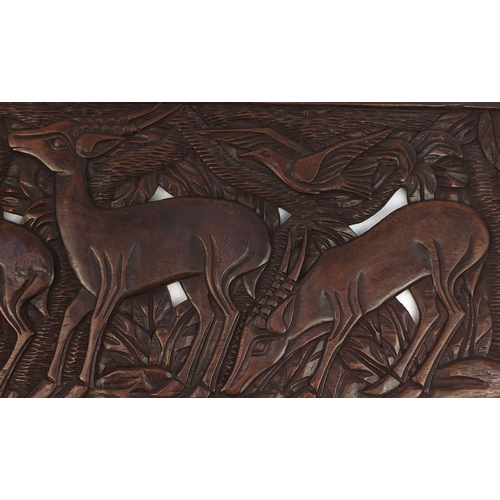 2115 - Large rectangular hardwood panel carved and pierced with deer's amongst trees, 150cm x 49cm