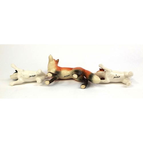 2081 - Three John Beswick animals comprising a fox and to Jack Russell's, each with factory marks to the ba... 