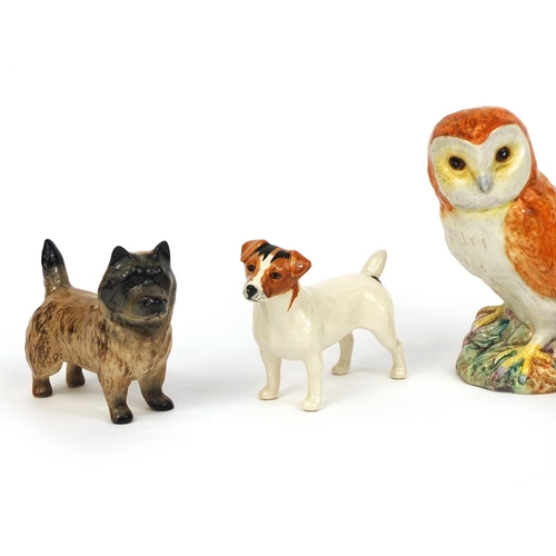 2083 - Five Beswick animals comprising Robin 980, an owl and three dogs, each with factory marks to the bas... 