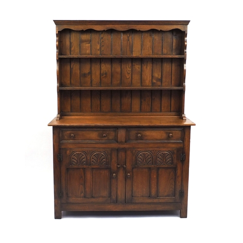 2029 - Ipswich oak dresser fitted with two plate racks above two drawers and a pair of carved doors, 180cm ... 