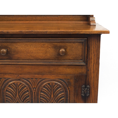 2029 - Ipswich oak dresser fitted with two plate racks above two drawers and a pair of carved doors, 180cm ... 