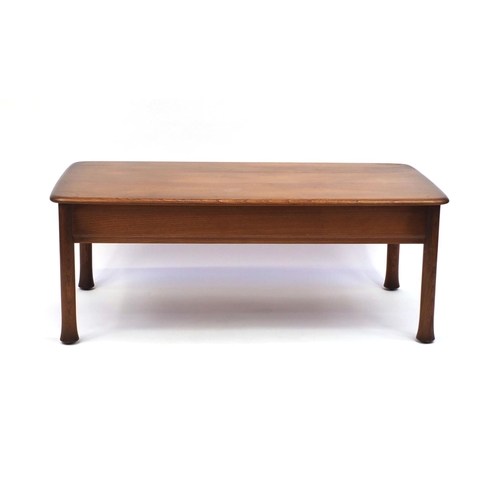 2052 - Ercol elm Windsor / Saville  inspired coffee table fitted with three frieze drawers, 44cm high x 119... 