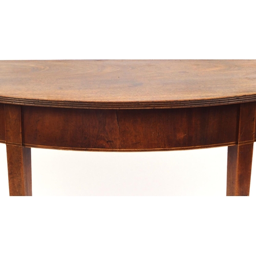 2024 - Georgian mahogany demi lune side table, with reeded edge on tapering legs, 70cm high x 121cm wide