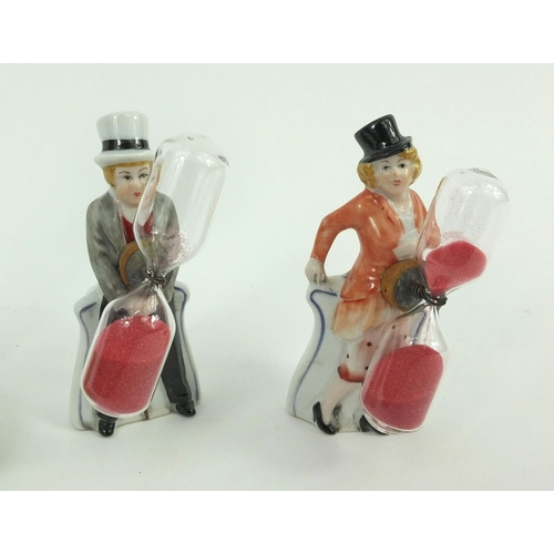 418 - Pair of Victorian style bisque figure sand timers and a bisque Keep Your Hair On advertising figure