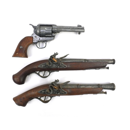 641 - Two decorative flintlock pistols and a revolver, the larger 37cm long