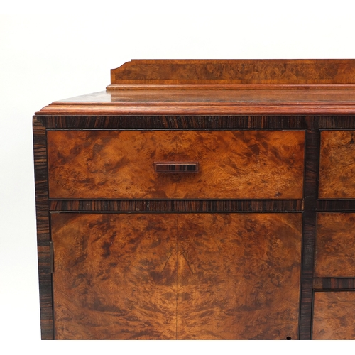 2045 - Art Deco burr walnut sideboard with padauk wood banding, fitted with an arrangement of drawers and c... 