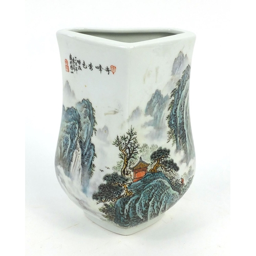 420 - Oriental porcelain triangular vase decorated with building amongst mountain, 19cm high