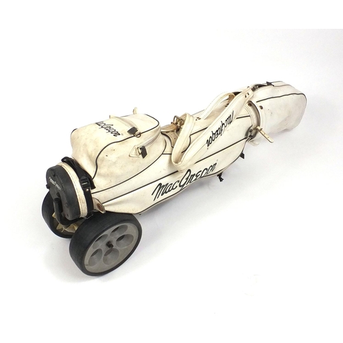 278 - Collection of mostly Dunlop golf clubs housed in a trolley