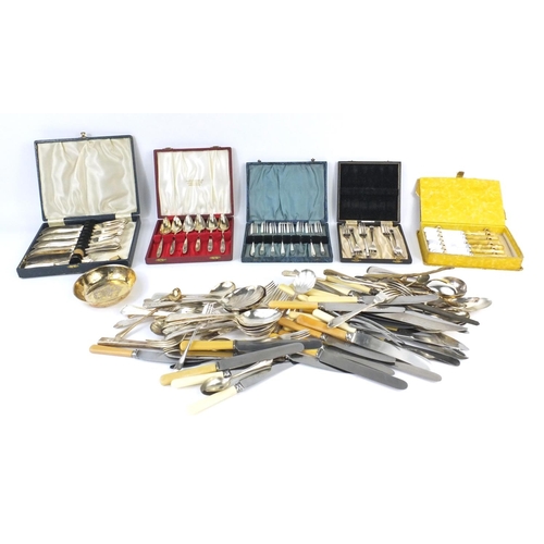 240 - Large selection of mostly silver plated and stainless steel cutlery, some with ivorine handles and c... 