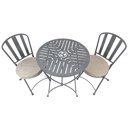 62 - Circular folding metal garden table and two chairs with cushion seats, 75cm high x 70cm in diameter