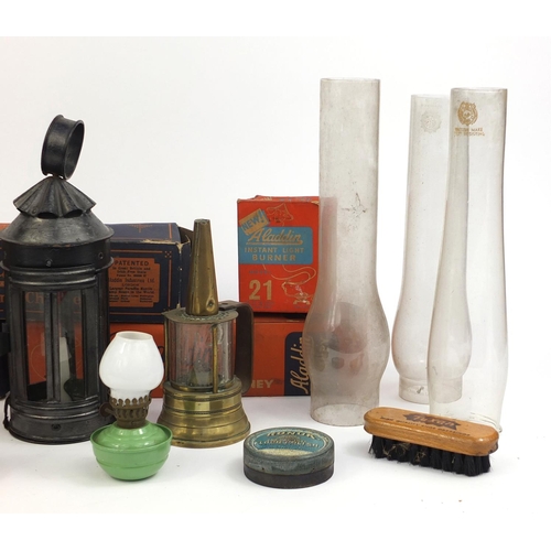 181 - Group of oil lamps and accessories including a house lamp protector, pigeon lampe mervcilleuse for b... 