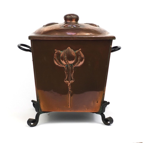 801 - Arts & Crafts four footed copper coal box with twin handles, of square tapering form, embossed with ... 