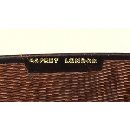 37 - Asprey of London three piece tooled leather desk set comprising pen stand, writing pad and tray, eac... 