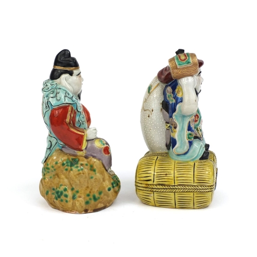 471 - Two Chinese porcelain figures, each hand painted in the Famille rose palette, one figure seated on t... 