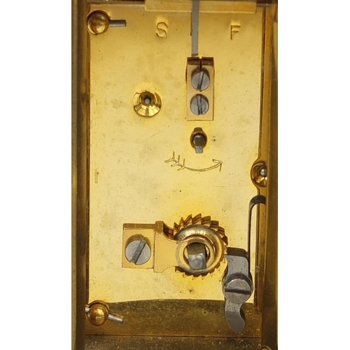 1102 - Matthew Norman of London oval brass cased carriage clock with bevelled glass and Roman numerals, 8cm... 